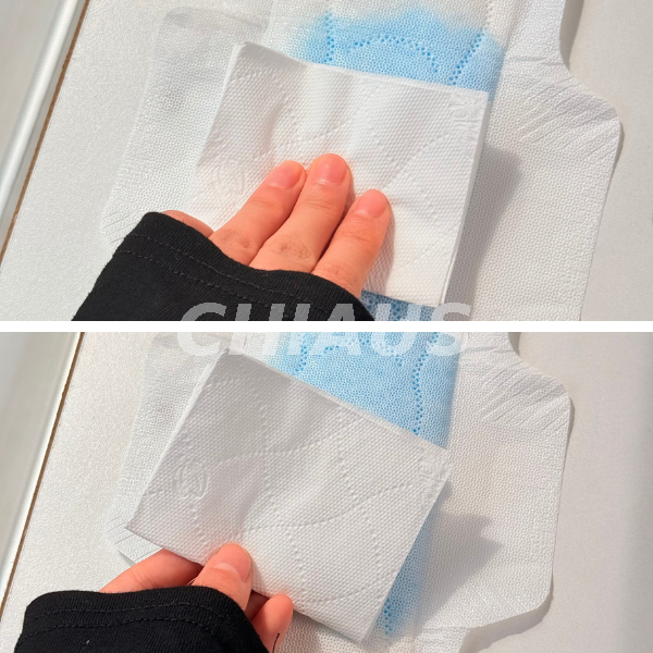 Hand Pressing a Sanitary Pad During a Surface Dryness or Rewet Test 