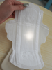 Close-up showing the ultra soft nonwoven topsheet of a sanitary pad with vertical perforation design